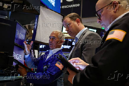 Traders work on the floor of the NYSE in New York