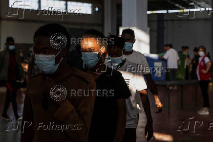 Newly-arrived migrants prepare to depart to mainland Greece, from Crete island
