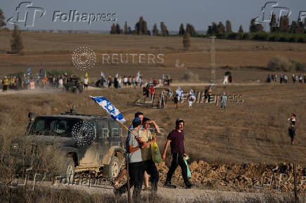 Israeli right wing activists take part in a rally organized by settlers groups to promote Israel's resettling in Gaza