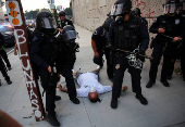 Protesters gather around the Los Angeles Federal Building after multiple detentions by ICE, in Los Angeles