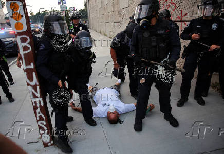 Protesters gather around the Los Angeles Federal Building after multiple detentions by ICE, in Los Angeles