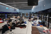 People shelter at Tel Aviv Light Rail Station amid ongoing Iranian ballistic missile threat