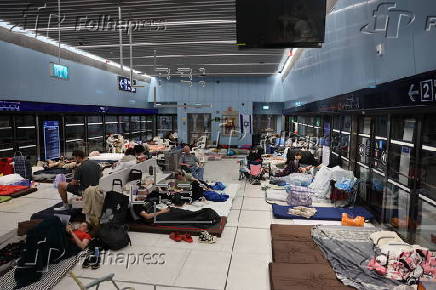 People shelter at Tel Aviv Light Rail Station amid ongoing Iranian ballistic missile threat
