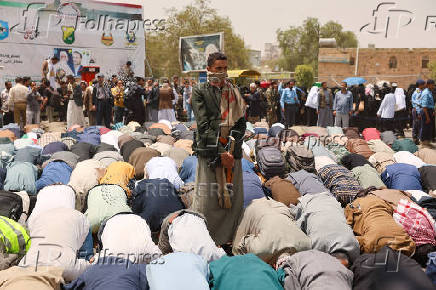 University students and professors perform prayers to ask for rain in Sanaa