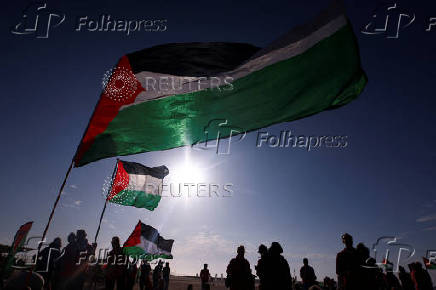 Pro-Palestinian protesters demonstrate on the Zuiderstrand beach against the violence in Gaza