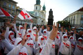 Siarhei Tsikhanouski attends a rally organised by Belarusian diaspora in Warsaw
