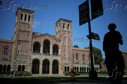 A person walks past Royce Hall at the University of California Los Angeles (UCLA) in Los Angeles
