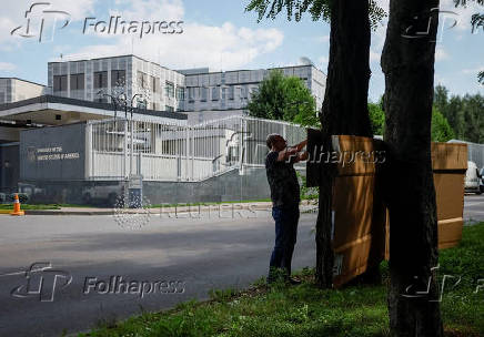 An activist takes part in a rally in front of the U.S. embassy in Kyiv