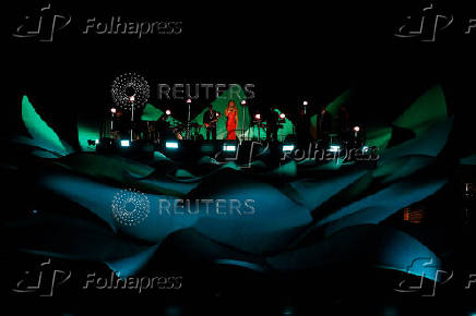 Mariah Carey performs on a floating stage shaped like a giant Victoria amazonica water lily at the Guama River in Belem