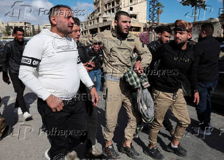 A family welcomes their released brother in today's prisoner exchange in Aleppo