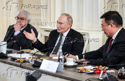 Russian President Vladimir Putin meets with heads of international news agencies in Saint Petersburg