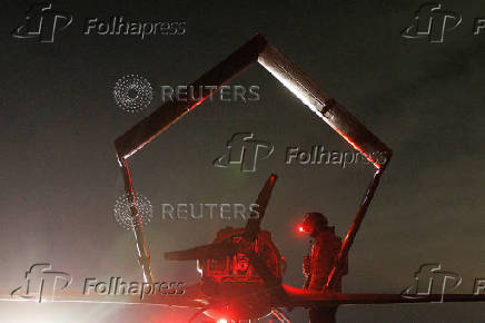 FILE PHOTO: A Ukrainian serviceman checks a deep strike drone before launching it toward Russian territory, in Ukraine