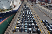A drone view shows new vehicles at container terminal in Kwai Tsing in Hong Kong