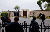 Members of the media stand outside the Turkish Presidency's Dolmabahce working office, in Istanbul
