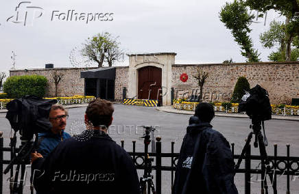 Members of the media stand outside the Turkish Presidency's Dolmabahce working office, in Istanbul