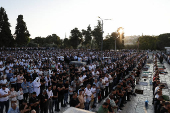 Palestinians pray on the first day of the Muslim holiday of Eid al-Adha, in Jerusalem's Old City