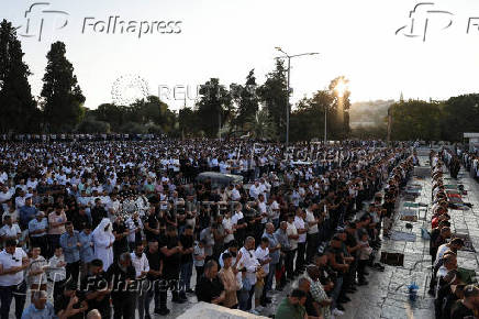 Palestinians pray on the first day of the Muslim holiday of Eid al-Adha, in Jerusalem's Old City