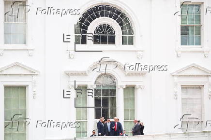 US President Trump walks on roof of the West Wing of the White House
