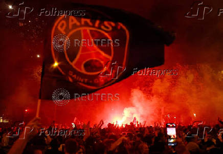FILE PHOTO: Paris St Germain fans celebrate with flares