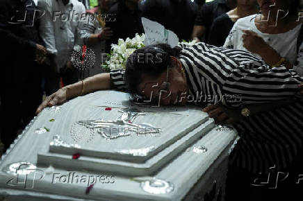 A family member burst into tears while hugging the coffin of Co-Pilot Clive Kunder, who died after an AIR India Boeing 787-8 Dreamliner plane crashed during take-off from an airport in Ahmedabad, in Mumbai