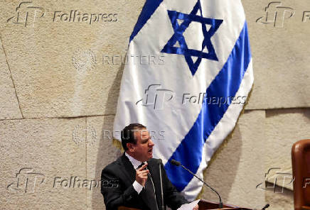 Israeli Knesset member Ayman Odeh speaks at the plenum in the Knesset, Israel's parliament, ahead of a vote over his possible expulsion from parliament, in Jerusalem
