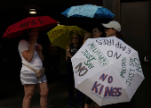 Demonstrators gather during a 