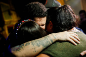 Arturo Suarez, who was held for months in an El Salvador prison, greets family members after his release, in Caracas