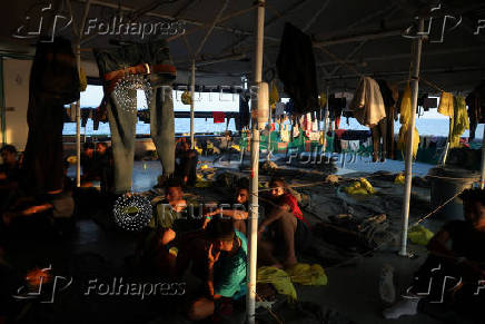 Rescued migrants aboard Sea-Watch 5 migrant search and rescue ship on their way to Italy