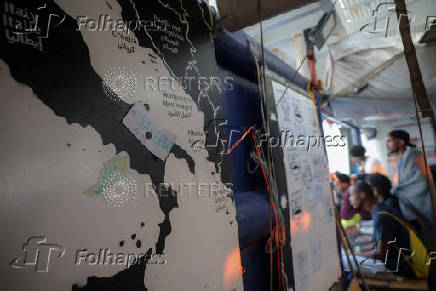 Rescued migrants arrive aboard Sea-Watch 5 ship in Salerno