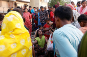 A woman mourns after her child died in a fire at a slum area in Rohini