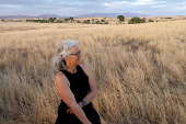 Janet Miller smiles as she watches the sun set, at the San Rafael Valley