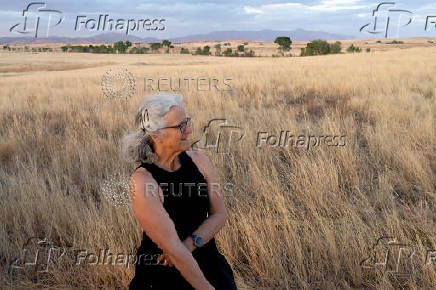 Janet Miller smiles as she watches the sun set, at the San Rafael Valley