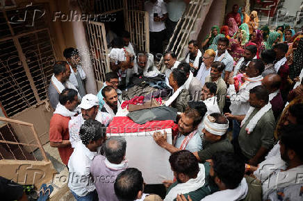 Family members carry the coffin of Ranvirsinh Chavda in Ahmedabad