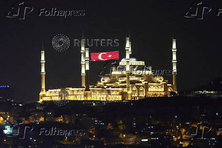 FILE PHOTO: Grand Camlica Mosque with an illuminating Turkish flag between the minarets is seen in Istanbul