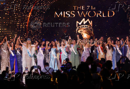 Czech Republic's Krystyna Pyszkova celebrates with other contestants after being crowned Miss World at the 71st Miss World finale in Mumbai