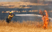A firefighter battles flames in Woodland California