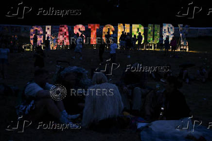 Revellers attend Glastonbury Festival at Worthy Farm in Pilton, Somerset, Britain