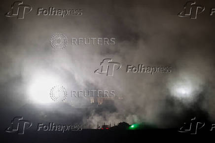 Israeli military vehicles manoeuvre in Gaza, as seen from the Israeli side of the Israel-Gaza border