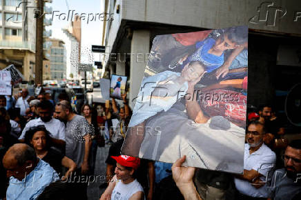 People take part in a protest against what organizers call 