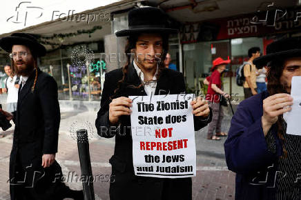 People take part in a protest against what organizers call 