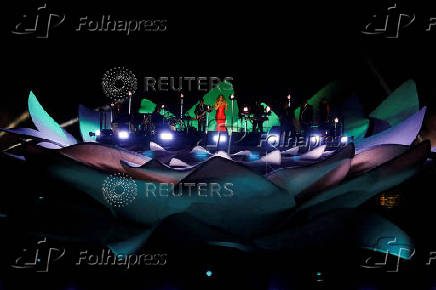 Mariah Carey performs on a floating stage shaped like a giant Victoria amazonica water lily at the Guama River in Belem