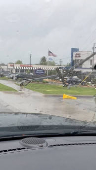 A broken utility pole lies in the aftermath of strong gusts of wind and rain, in Springfield, Missouri