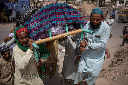 Ansari family carry body of a matriarch to burial place in Multan, Pakistan