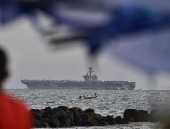 The US Navy’s Nimitz-class nuclear-powered aircraft carrier USS George Washington (CVN-73) anchors at Manila Bay