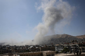 Smoke rises after strikes on Syria's defense ministry in Damascus