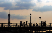The Pont des Arts bridge and the Eiffel Tower in Paris
