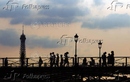 The Pont des Arts bridge and the Eiffel Tower in Paris