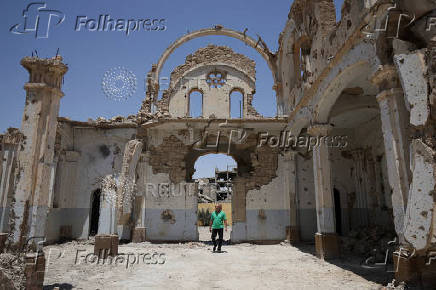 Christian citizen, George Kostantine, one of the few remaining Christians in Deir el-Zor, walks at the damaged Christ the King church in Deir el-Zor