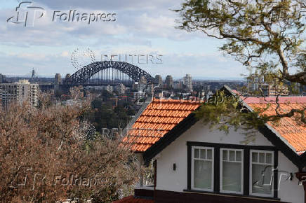 View of the Sydney Harbour Bridge next to a residential properties in Sydney