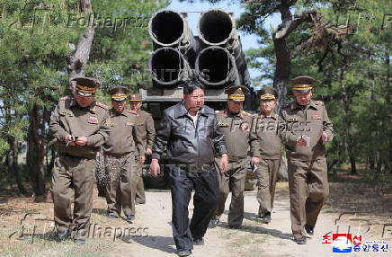 A handout photo shows North Korean leader Kim Jong Un supervise a missile test